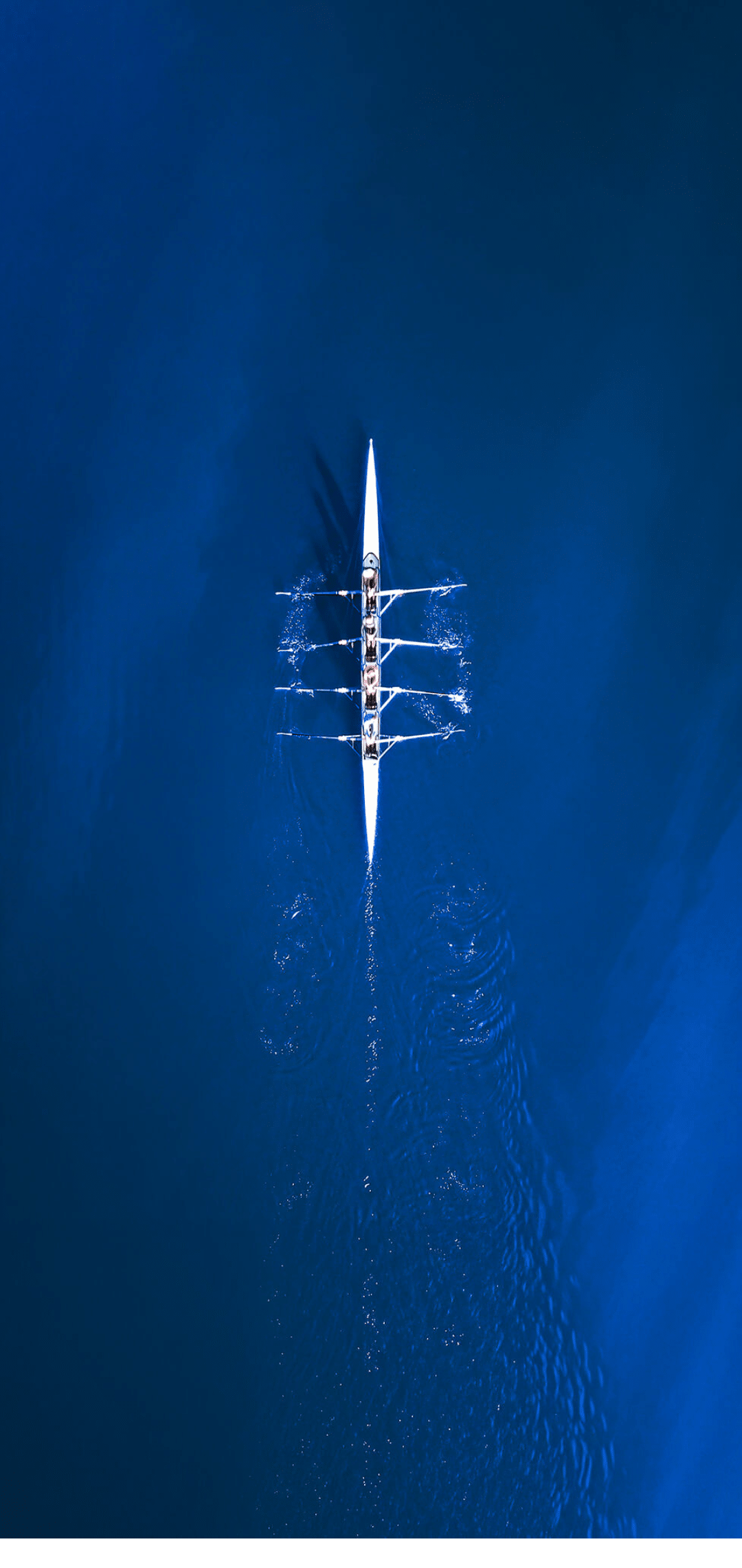 A blue ocean with a white and black boat in the distance. AI generated content