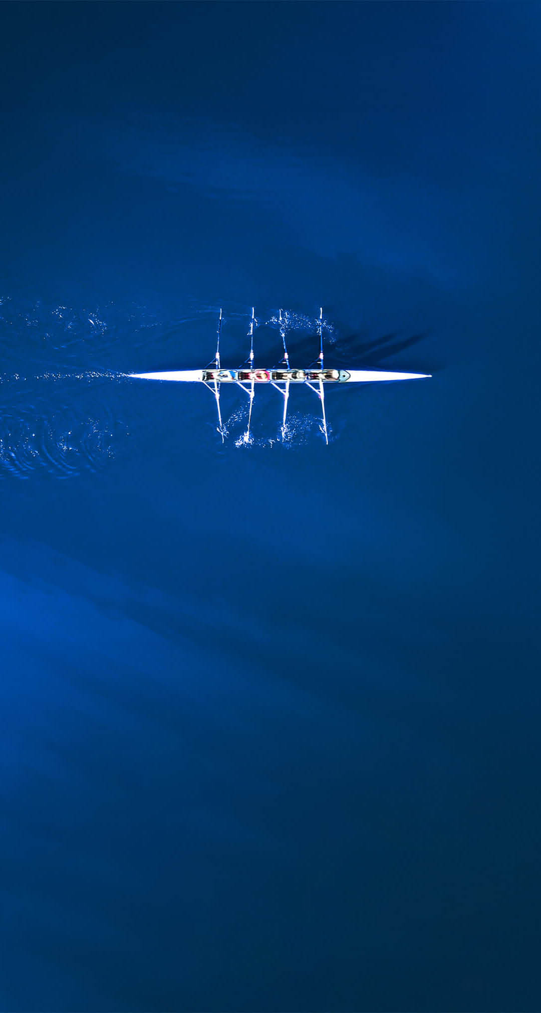 A boat is in the water with a reflection of it in the water. AI generated content