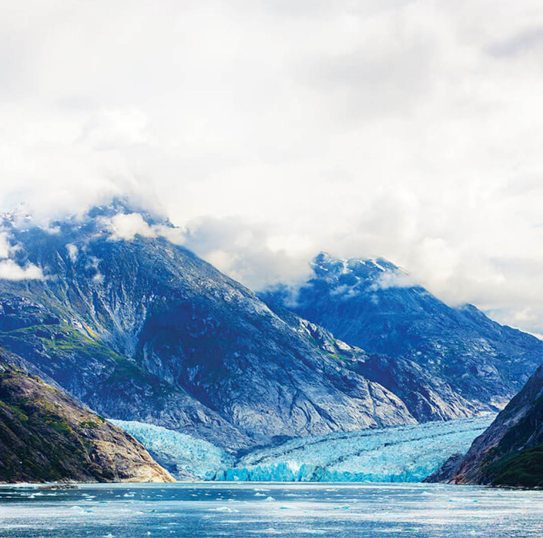 A large body of water with mountains in the background. AI generated content