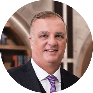 A man wearing a suit and tie is smiling for the camera. AI generated content