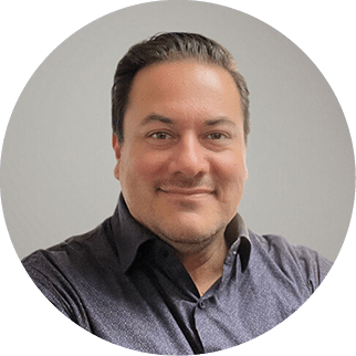 A man wearing a blue shirt and black wristwatch poses for a picture. AI generated content